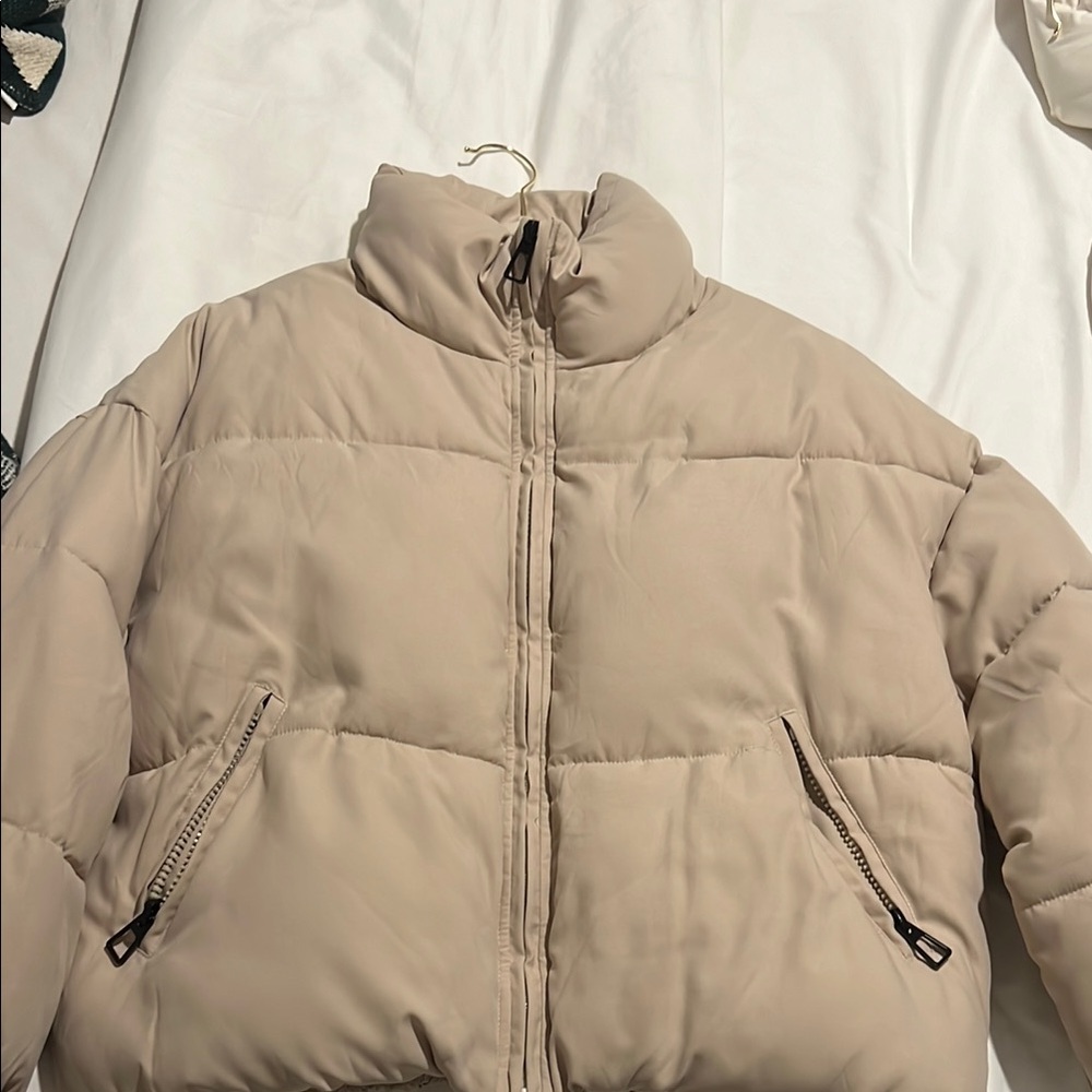 Tan Puffer Jacket with High Collar and Quilted Design